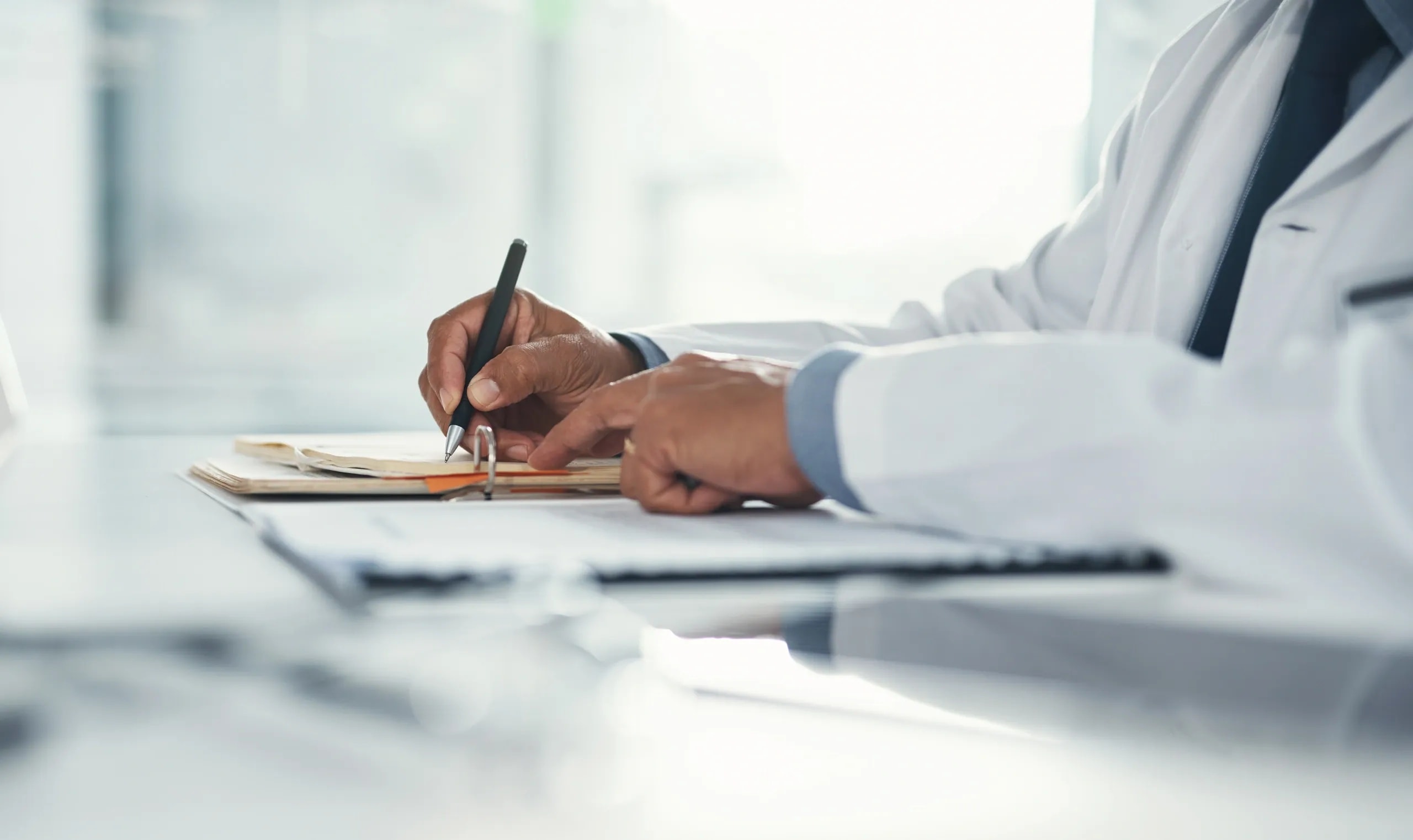 Doctor reviewing legal healthcare compliance documents